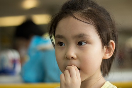 The little girl playing at the playgroundの写真素材