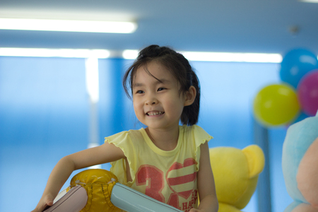 The little girl playing at the playgroundの写真素材