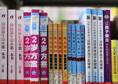 Choosing books to read in the library.のeditorial素材