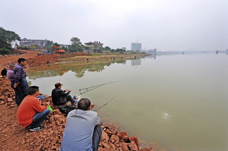 A group of people fishing in the river.のeditorial素材