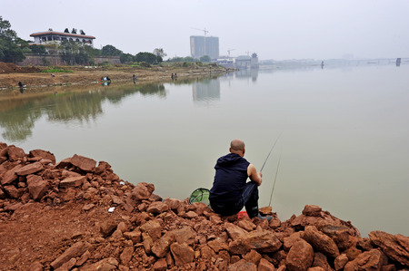 A group of people fishing in the river.の写真素材