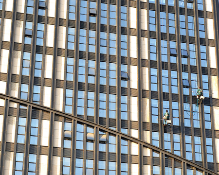 window washers working on the modern buildingのeditorial素材