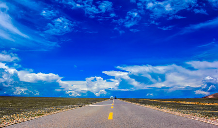 Asphalt road under blue sky