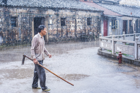 Farmers in the rainのeditorial素材