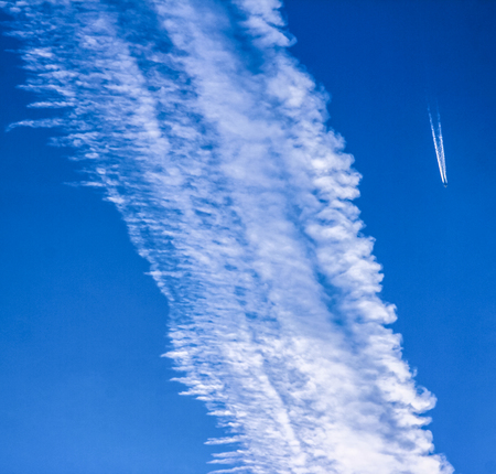 The plane and the cloudsの写真素材