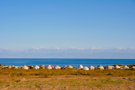 shore of Lake Issyk-Kul with yurtsの写真素材