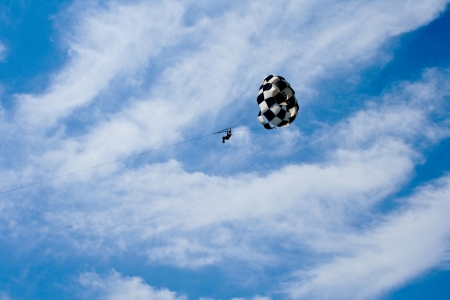 parachute jumping in the sky with cloudsの写真素材