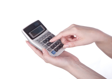 calculator and money in hand on whiteの写真素材