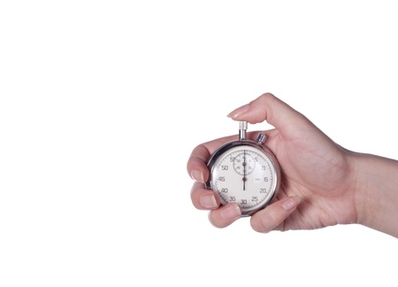 Stopwatch in a female hand on a whiteの写真素材