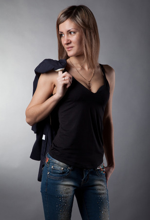 beautiful girl on a gray background in studioの写真素材