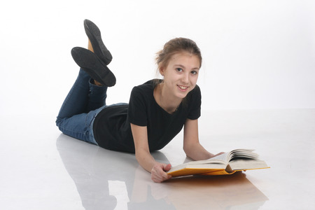 teenage girl with books on white backgroundの写真素材