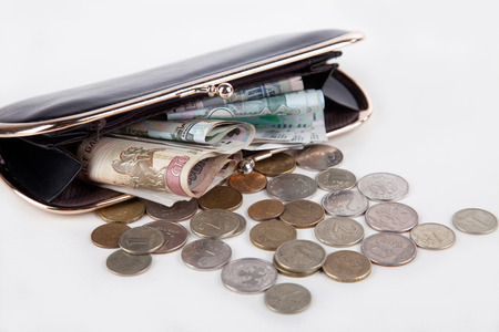 Ruble money in black purse on white background