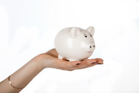 piggy bank in a female handの写真素材