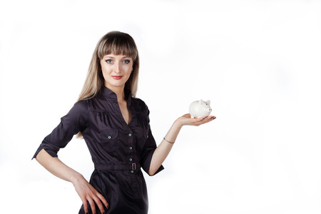 piggy bank in hand beautiful girlの写真素材