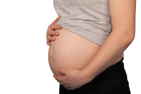 young couple expecting a child poyaleniya on a white backgroundの写真素材
