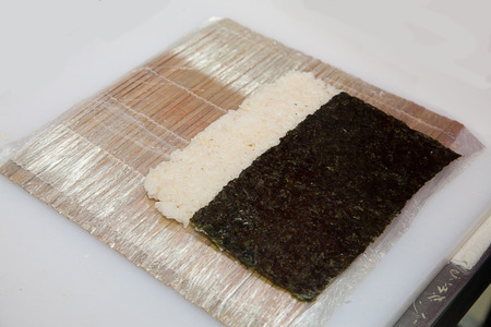 the process of preparing sushi Philadelphia on the tableの写真素材