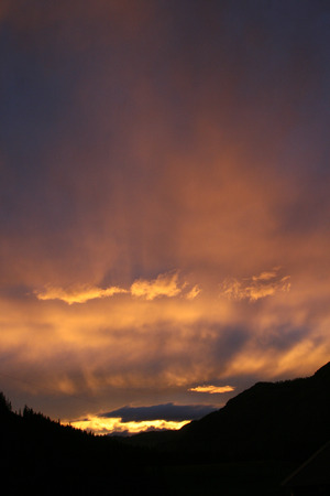 the evening sky in summer in the mountains of Altaiの写真素材