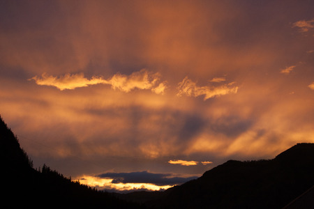 the evening sky in summer in the mountains of Altaiの写真素材