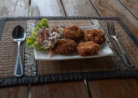 Grilled shrimps and lettuce on a wooden table. Thai cuisineの写真素材