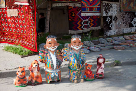 Clay figurines of Uzbeks and ornamented dishes for pilaf. Souvenirs of Uzbekistan. National art. April 29, 2019.のeditorial素材