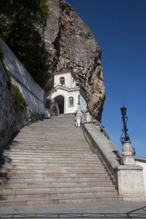 Staircase in the Holy Dormition Monastery, carved into the rock, in Bakhchisarai in the Crimea in the summer. Travel concept. Vertical. October 3, 2020のeditorial素材