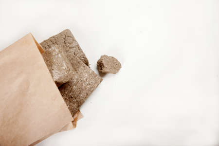 Halva in a paper bag lies on a white background. Zero waste conceptの写真素材