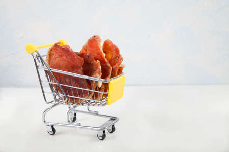 Pieces of jerky are in the grocery cart. Copy spaes.の写真素材