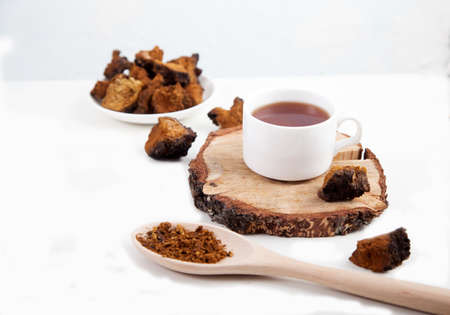 Healthy drink coffee from chaga mushroom in a porcelain bowl on a white background. top view. Copt...