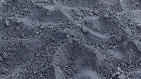 Closeup of the surface of the black sand. Abstract background.の素材