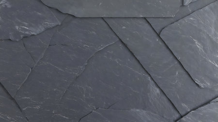 Dark grey slate background or texture. Close-up of stone surface.の素材