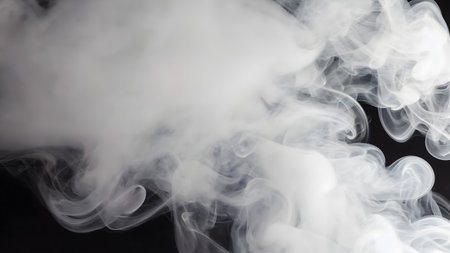 White smoke isolated on black background. Close-up of white cloud of steam.の素材