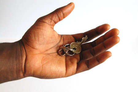 This is an image of a hand offering a key.