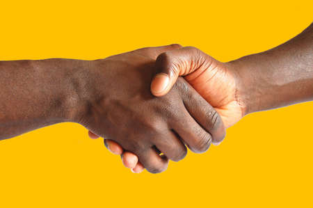 This is an image of two hands performing a handshake.の写真素材