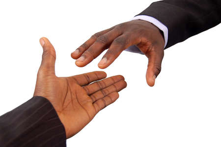 This is an image of a pair of black business hands reaching out to each other. Metaphor for contract agreement, business help, employment opportunities etc..の写真素材