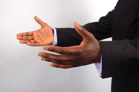 This is an image of a pair of hands offering help, "business style".の写真素材