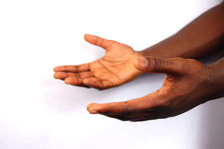 This is an image of a pair of black hands offering help.
の写真素材