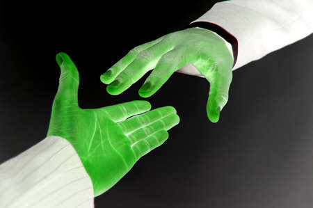 This is an image of two digital hands reaching out to each other.の写真素材