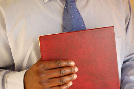 This is an image of businessman prepared for his interview.(portfolio in hand).の写真素材