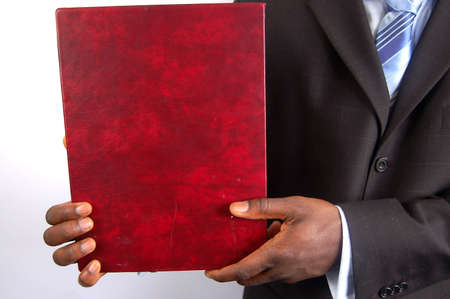 This is an image of man holding a portfolio.の写真素材