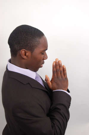 This is an image of a man on his knees prayingの写真素材