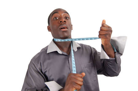 This is an image of man with a measuring tape round his neck. This image can be used to imply frustration, fashion crazy, mad tailor man etc...の写真素材