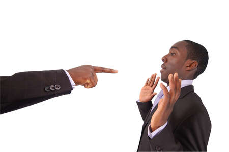 This is an image of a hand pointing at a businessman. This image can used to represent blame themes, accusation etc...の写真素材