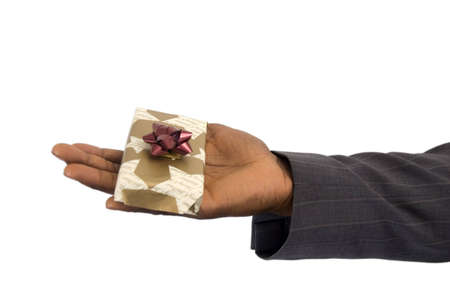 This is an image of a hand offering a christmas present.