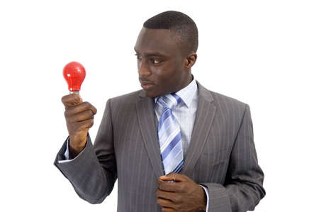 This is an image of a businessman full of inspiration represented by the "red light bulb".の写真素材