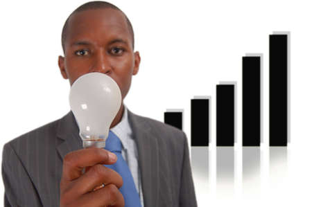 This is an image of a businessman trying to think of an idea. The graph in the background represents progress.の写真素材