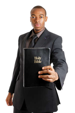 This is an image of a man holding a bible showing commitment.