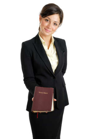 This is an image of business woman holding a bible.の写真素材