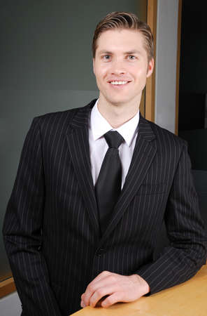This is an image of a confident smiling business man.の写真素材