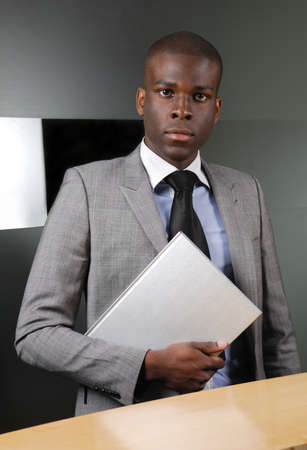 This is an image of business man with a book.の写真素材