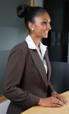 This is an image of a smiling business woman by the reception.の写真素材